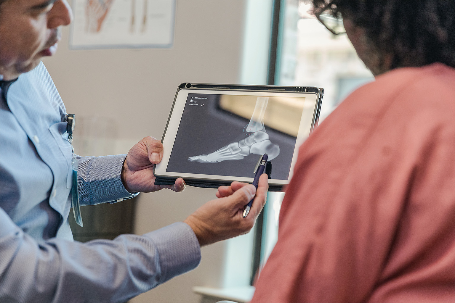 Podiatrist explaining X-ray findings